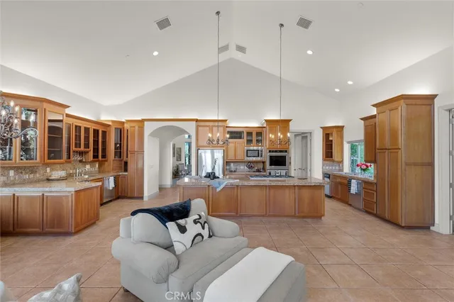 a living room with furniture and a ceiling fan