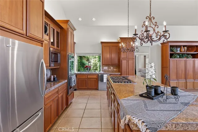 a dining room with furniture and a floor to ceiling window