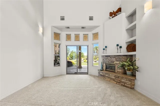 a bedroom with two beds and a walk in closet