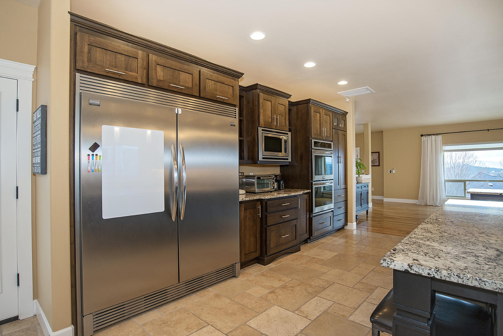 1360 Poppy Ridge Drive Eagle Point, OR 97524 - Photo 6 of 34 a kitchen with stainless steel appliances granite countertop a refrigerator and a sink