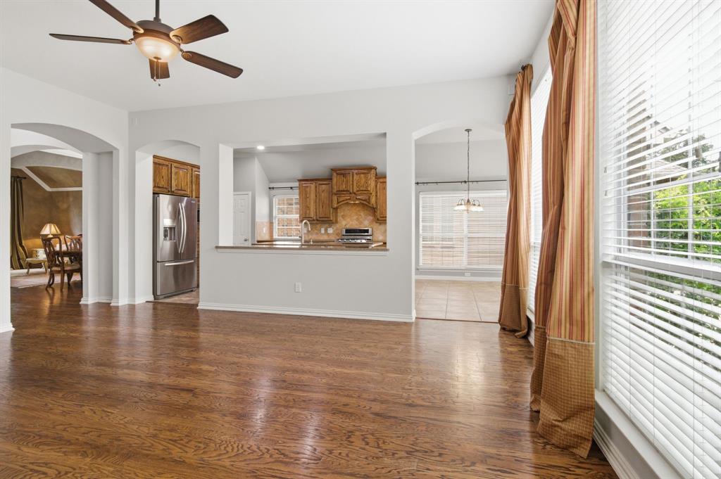 8180 Holliday Road Lantana, TX 76226 - Photo 10 of 31 The family room and kitchen create an overflow of space for entertaining.