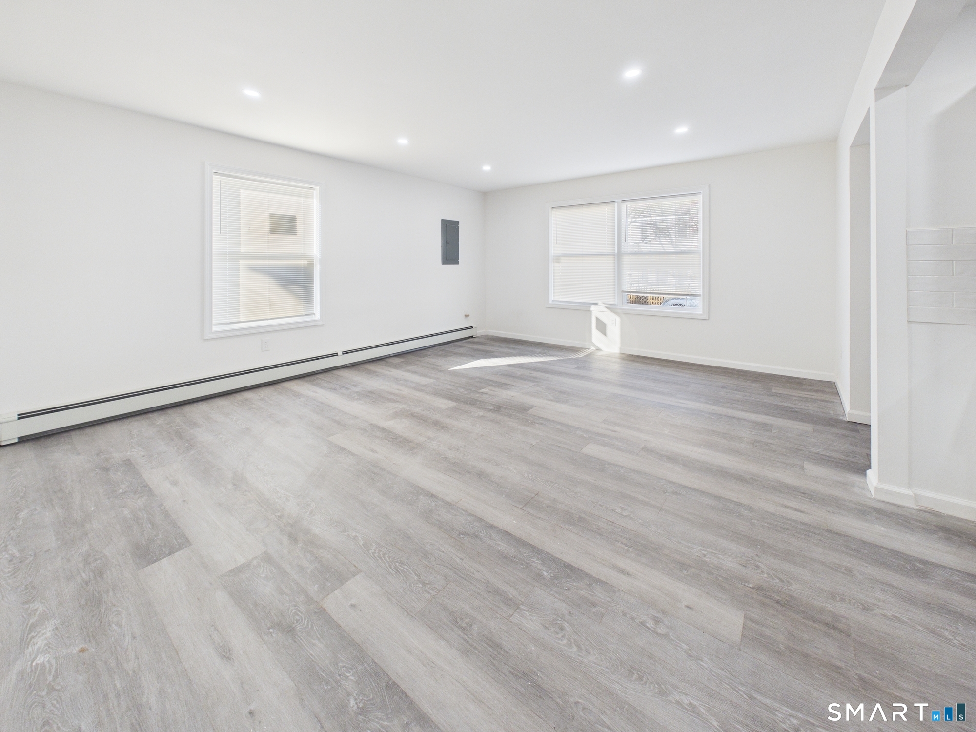 23 Dewitt Street New Haven, CT 06519 - Photo 26 of 36 a view of an empty room with wooden floor and a window