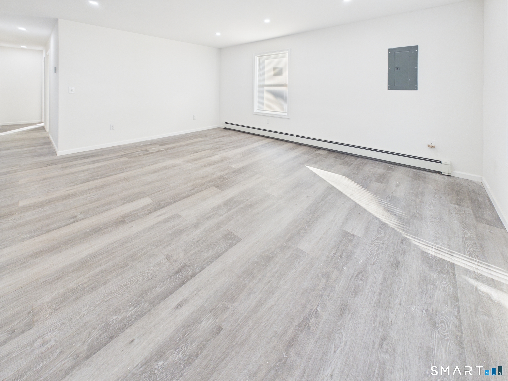 23 Dewitt Street New Haven, CT 06519 - Photo 27 of 36 a view of an empty room with wooden floor
