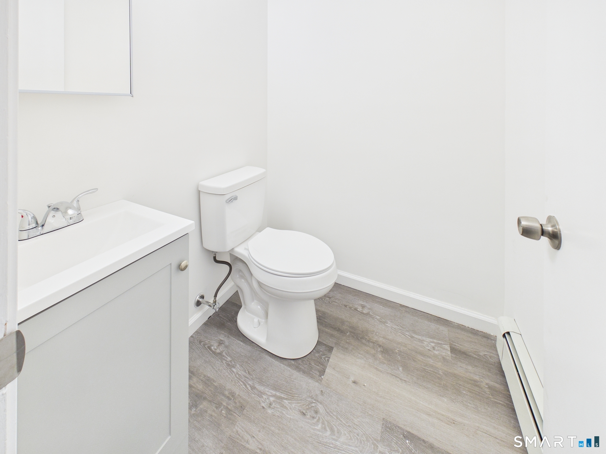 23 Dewitt Street New Haven, CT 06519 - Photo 32 of 36 a white toilet sitting next to a white sink