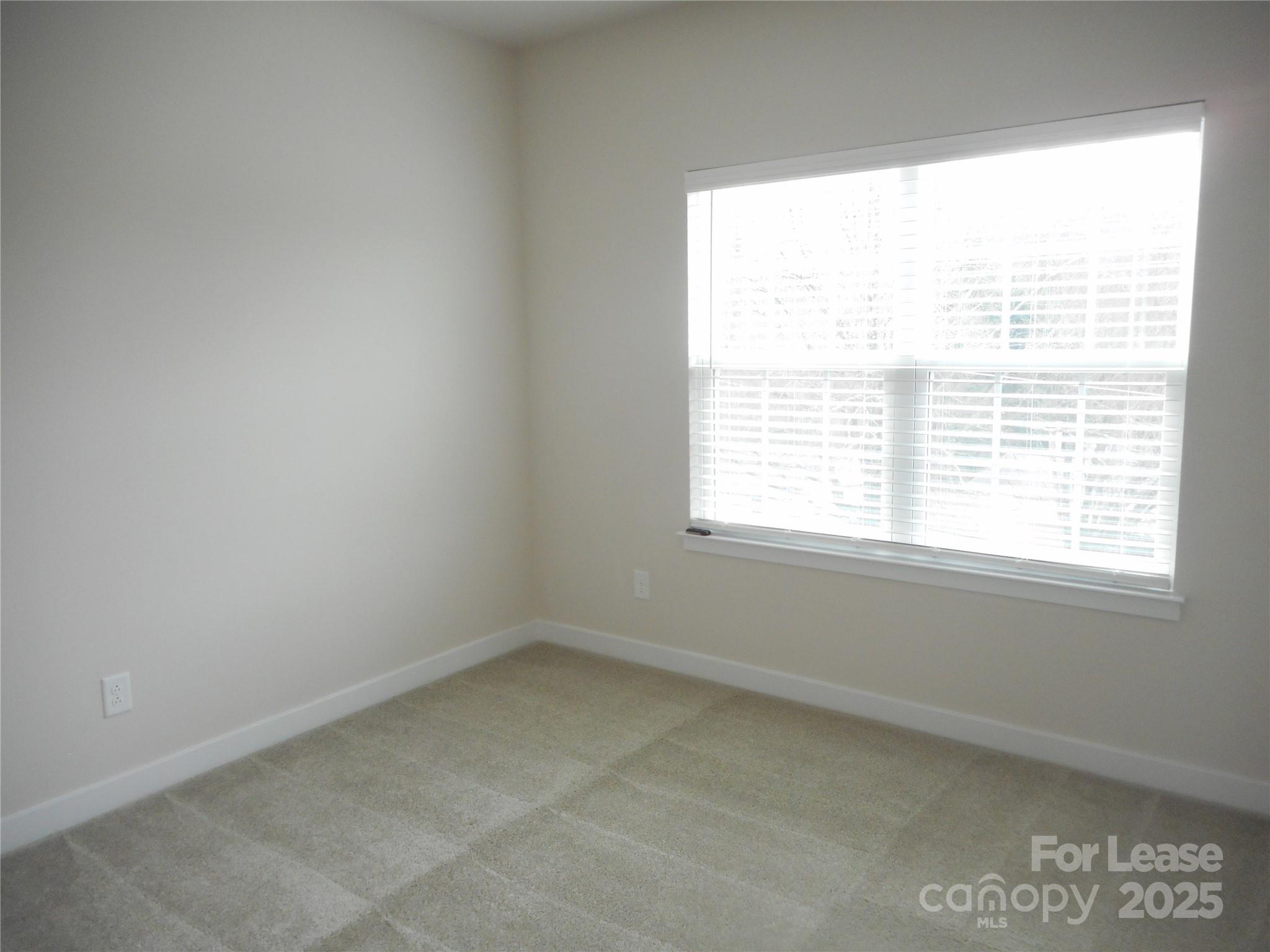 3033 Matthews-Indian Trail Road Matthews, NC 28104 - Photo 17 of 30 a view of an empty room with a window