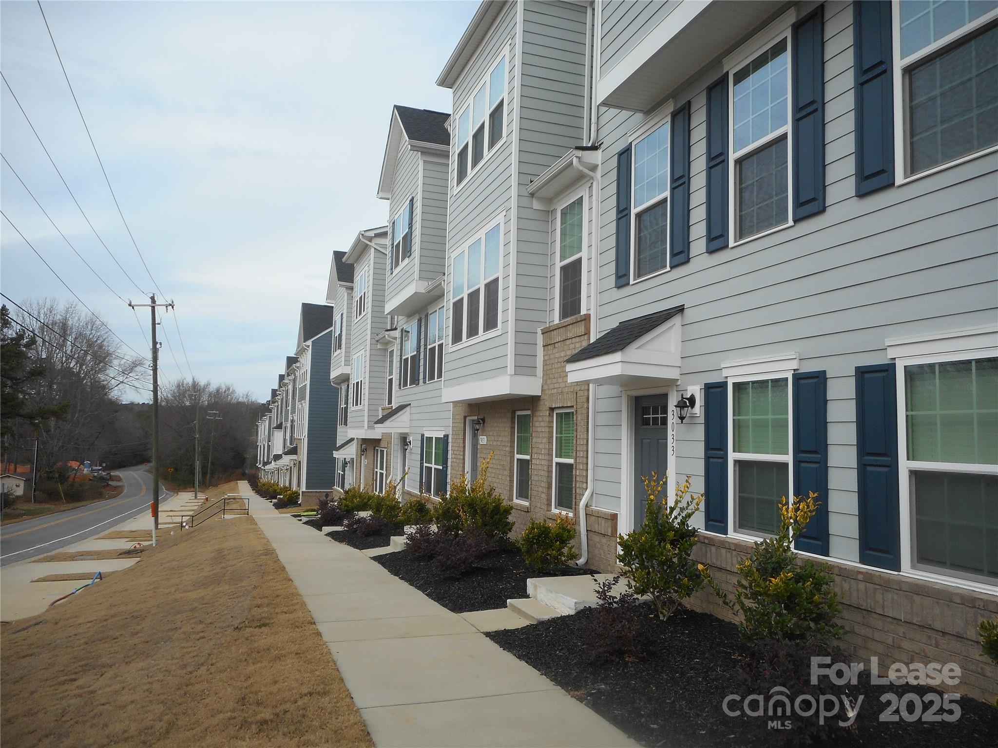 3033 Matthews-Indian Trail Road Matthews, NC 28104 - Photo 26 of 30 a view of a building with potted plants