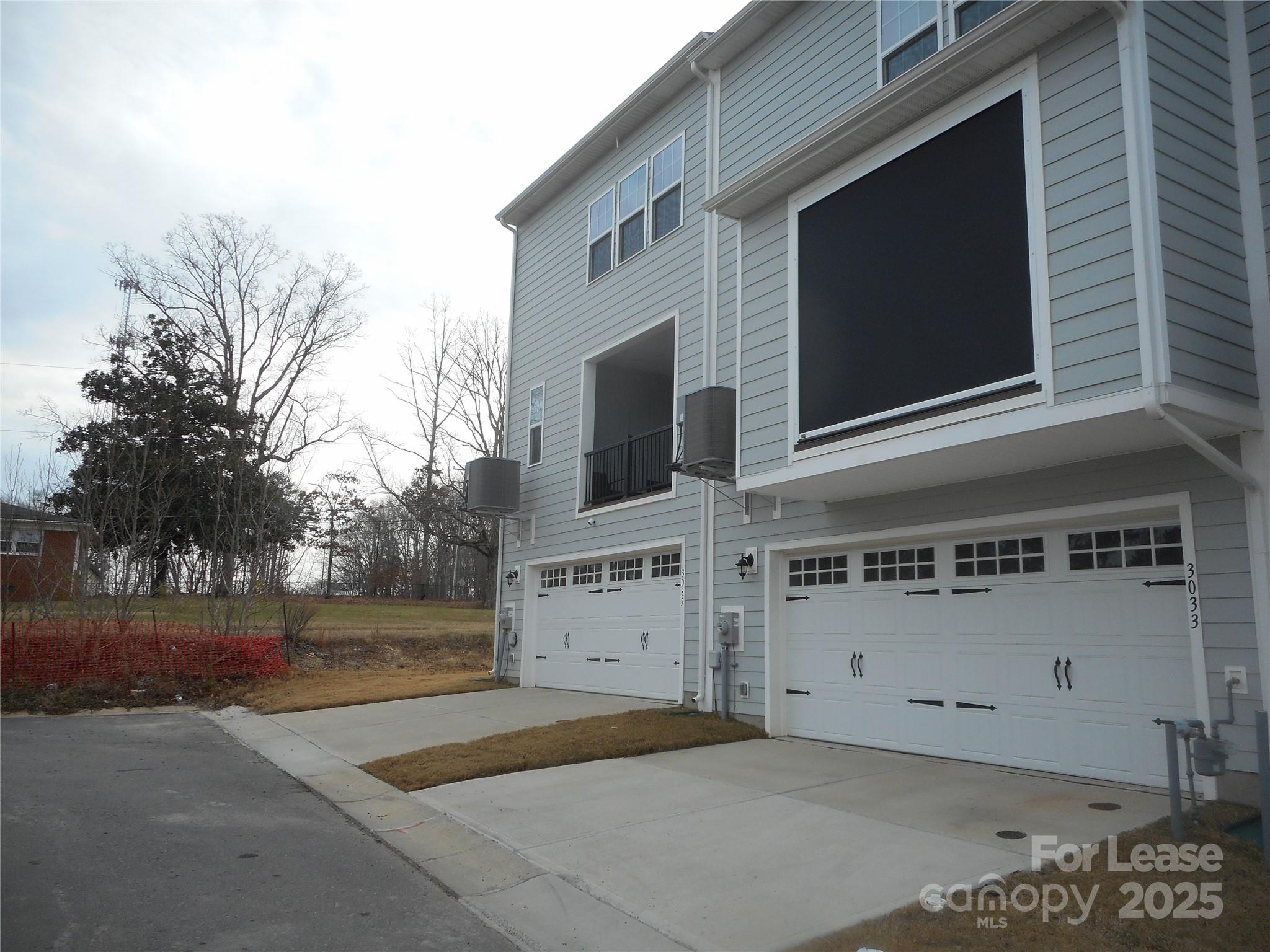 3033 Matthews-Indian Trail Road Matthews, NC 28104 - Photo 29 of 30 a view of a house with a yard