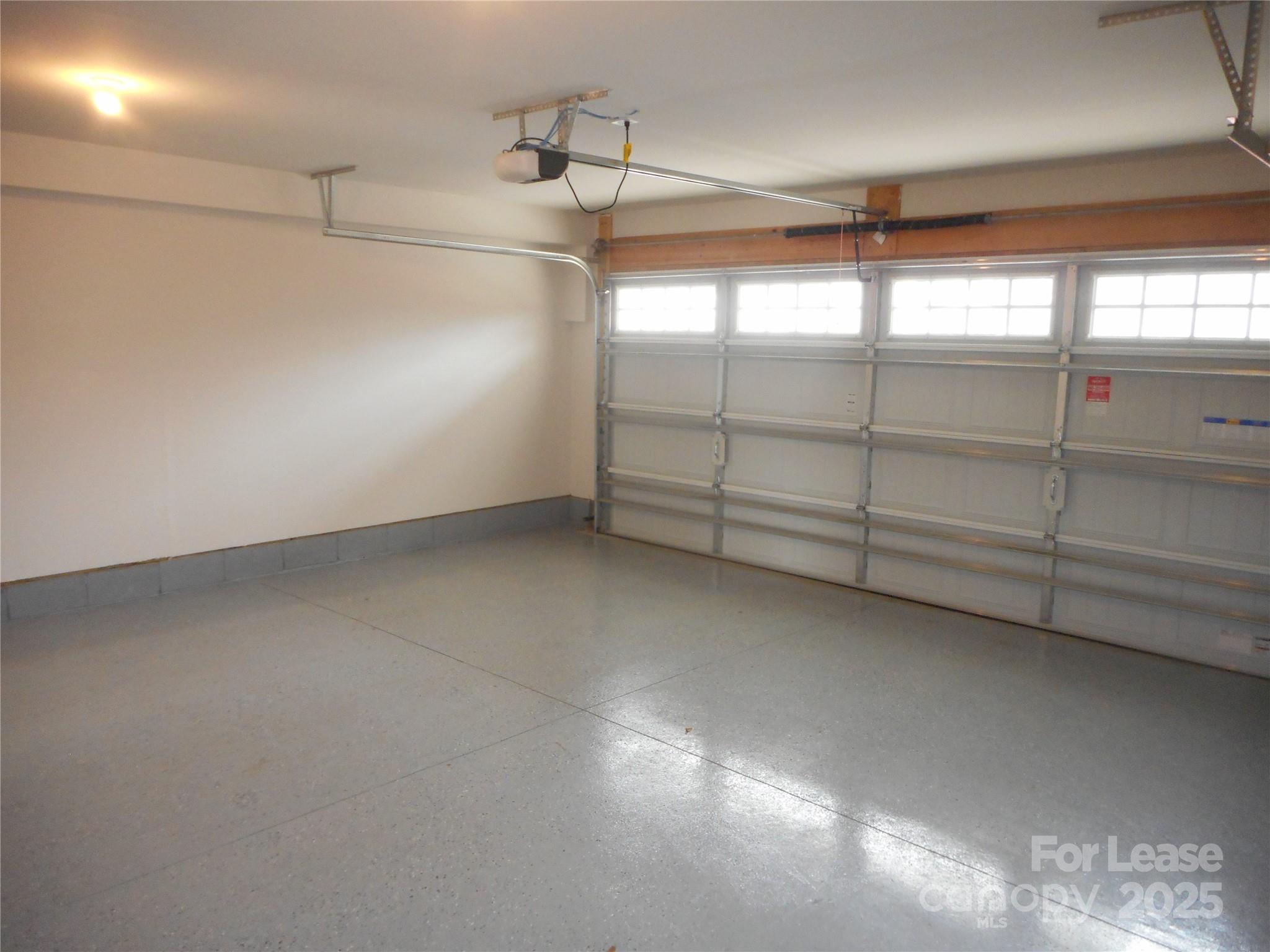 3033 Matthews-Indian Trail Road Matthews, NC 28104 - Photo 3 of 30 a view of a room with racks on the wall
