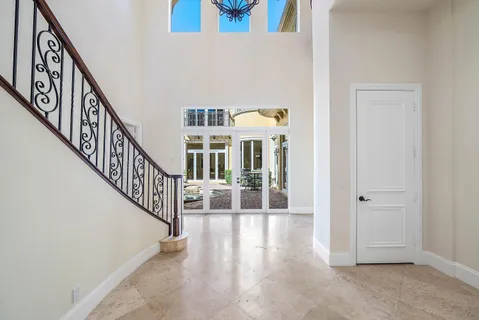 a large kitchen with a table and chairs