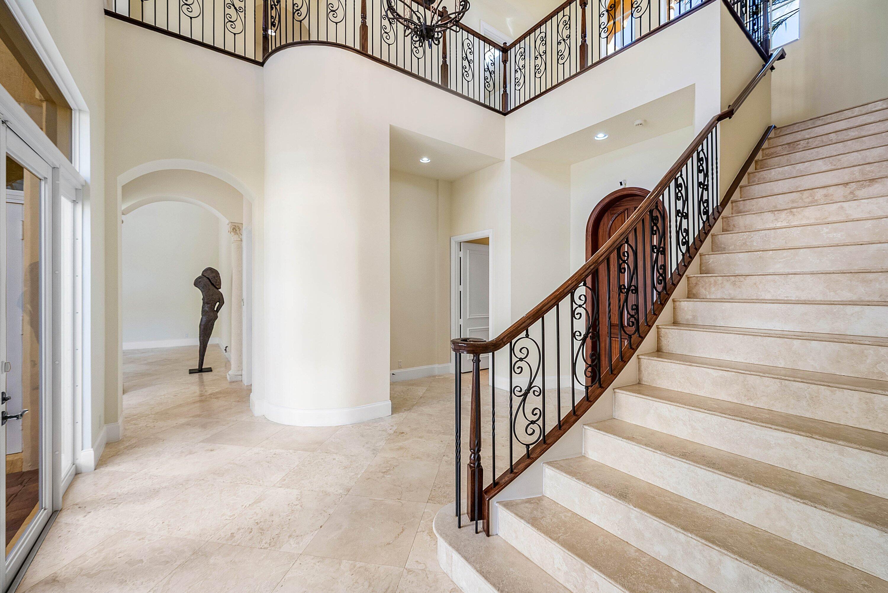 17387 Balaria Street Boca Raton, FL 33496 - Photo 16 of 65 a view of a hallway with staircase