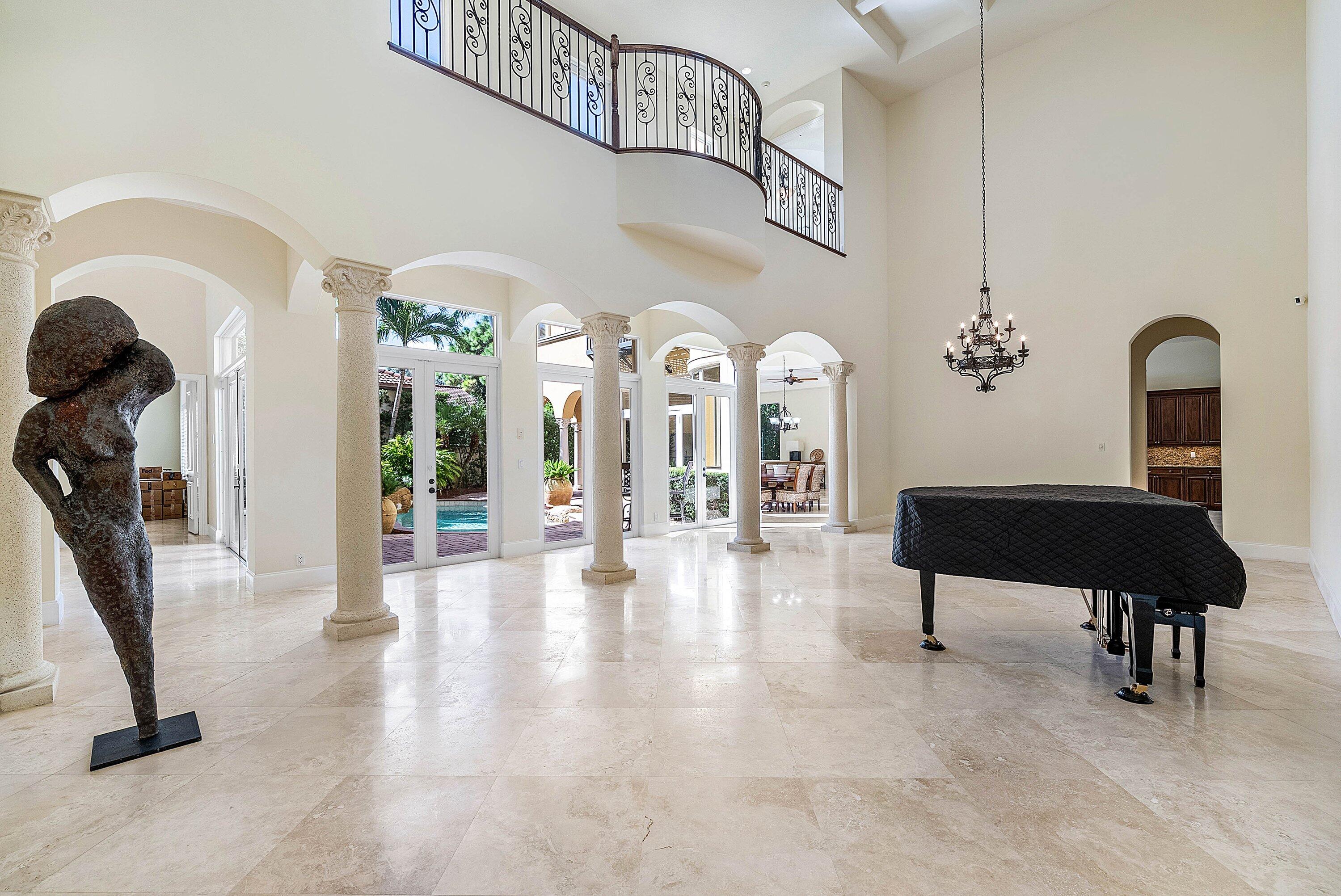 17387 Balaria Street Boca Raton, FL 33496 - Photo 18 of 65 a view of a livingroom with furniture and a gym equipment