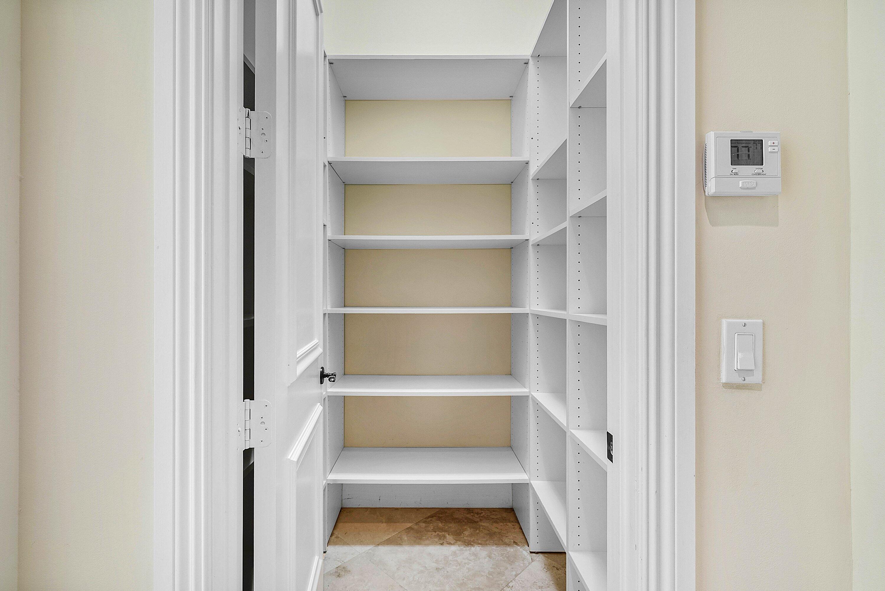 17387 Balaria Street Boca Raton, FL 33496 - Photo 23 of 65 a view of walk in closet with empty racks