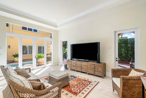 a view of a living room with furniture and wooden floor