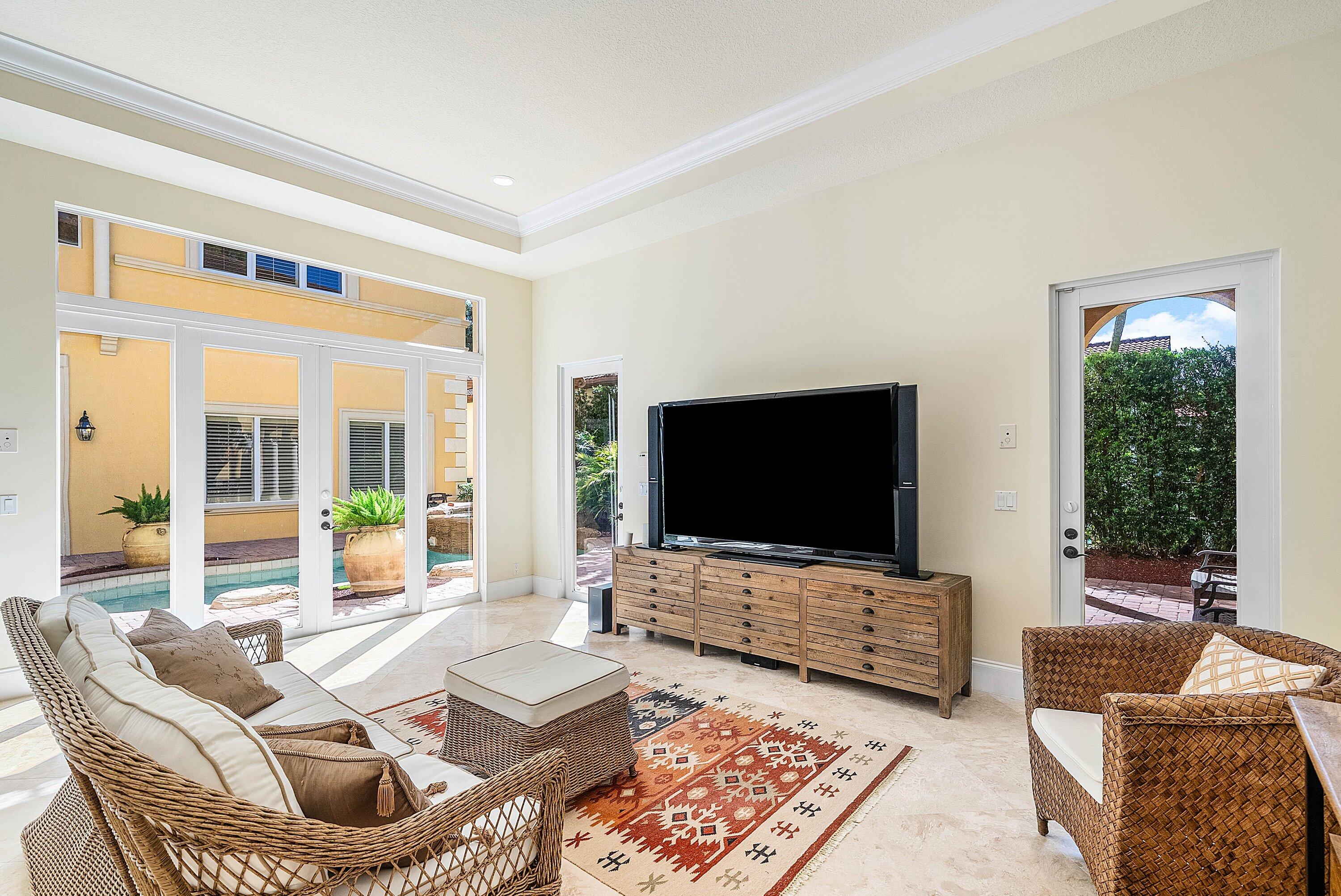17387 Balaria Street Boca Raton, FL 33496 - Photo 26 of 65 a living room with furniture and a flat screen tv
