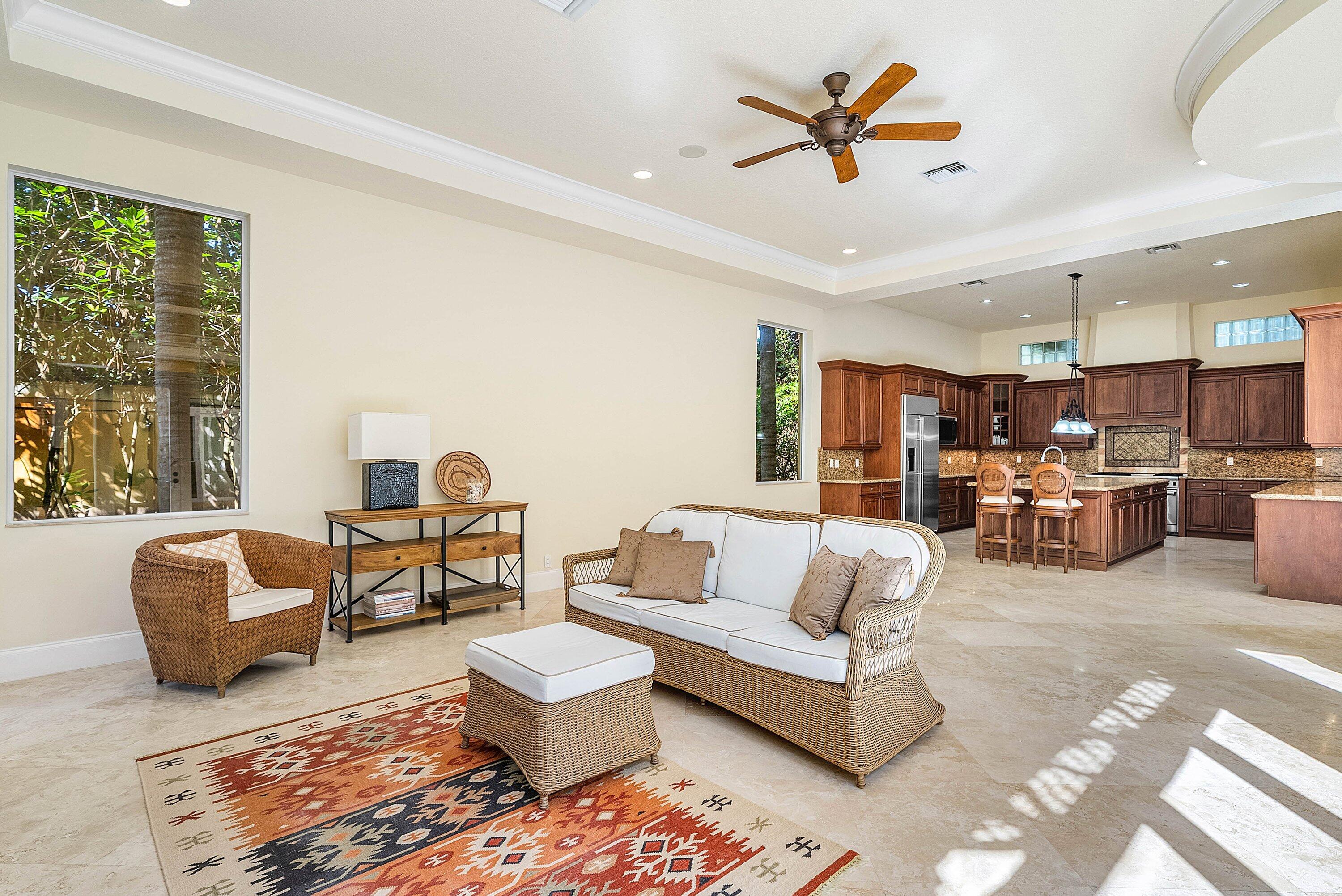 17387 Balaria Street Boca Raton, FL 33496 - Photo 27 of 65 a living room with furniture kitchen view and a large window