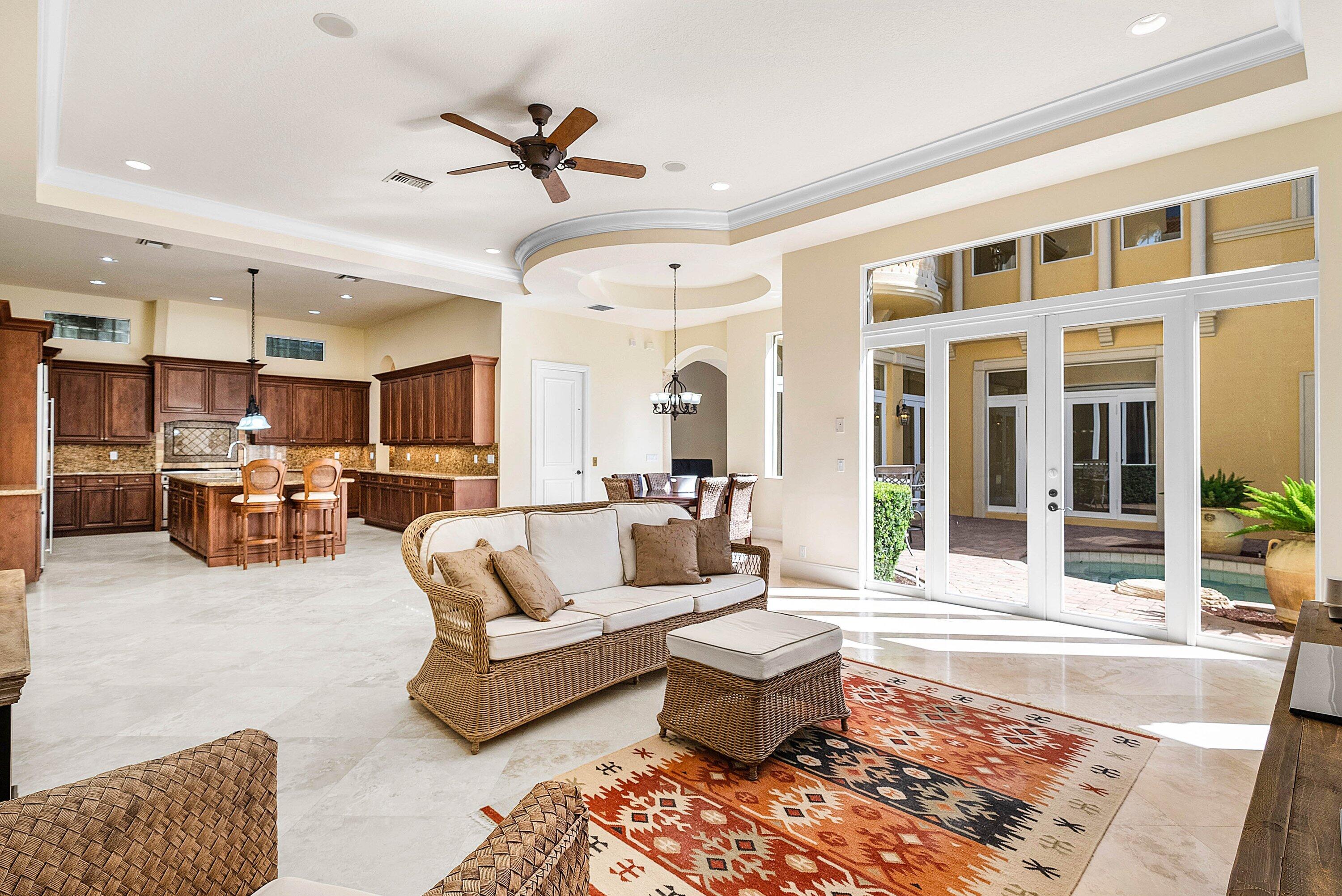 17387 Balaria Street Boca Raton, FL 33496 - Photo 28 of 65 a living room with furniture kitchen view and a large window