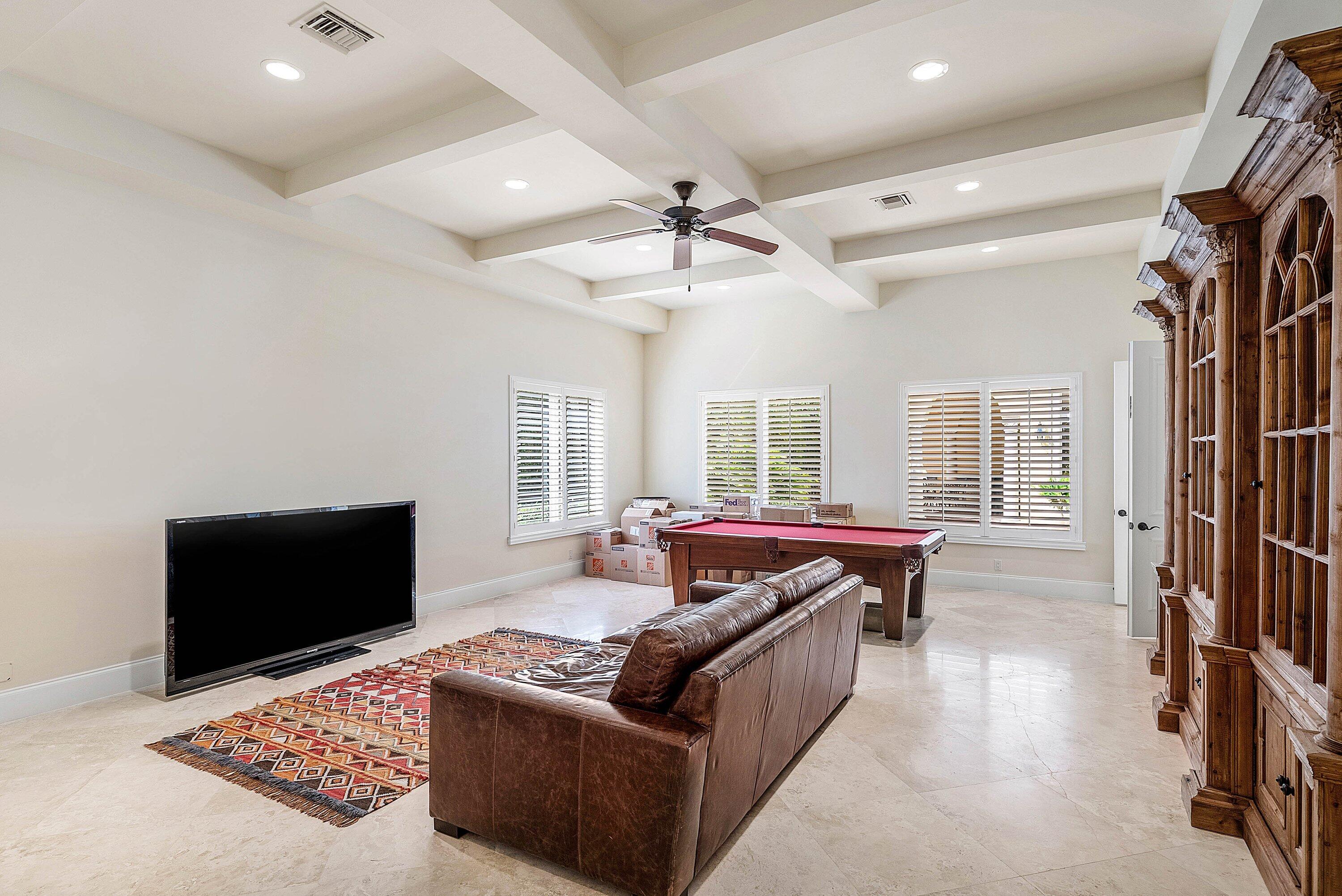 17387 Balaria Street Boca Raton, FL 33496 - Photo 31 of 65 a living room with furniture and a flat screen tv