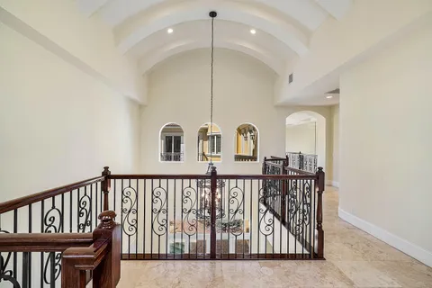 a view of hallway with wooden floor