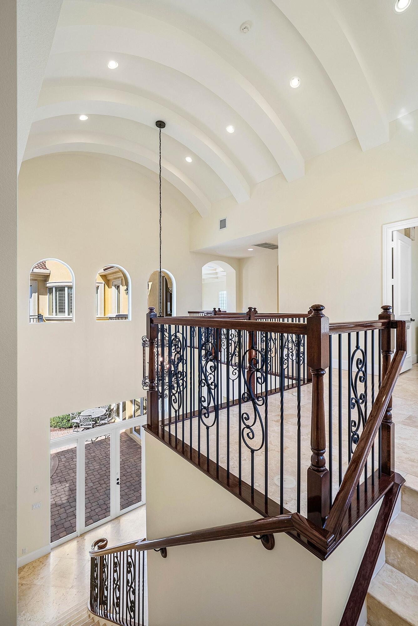 17387 Balaria Street Boca Raton, FL 33496 - Photo 35 of 65 a view of a hallway with windows