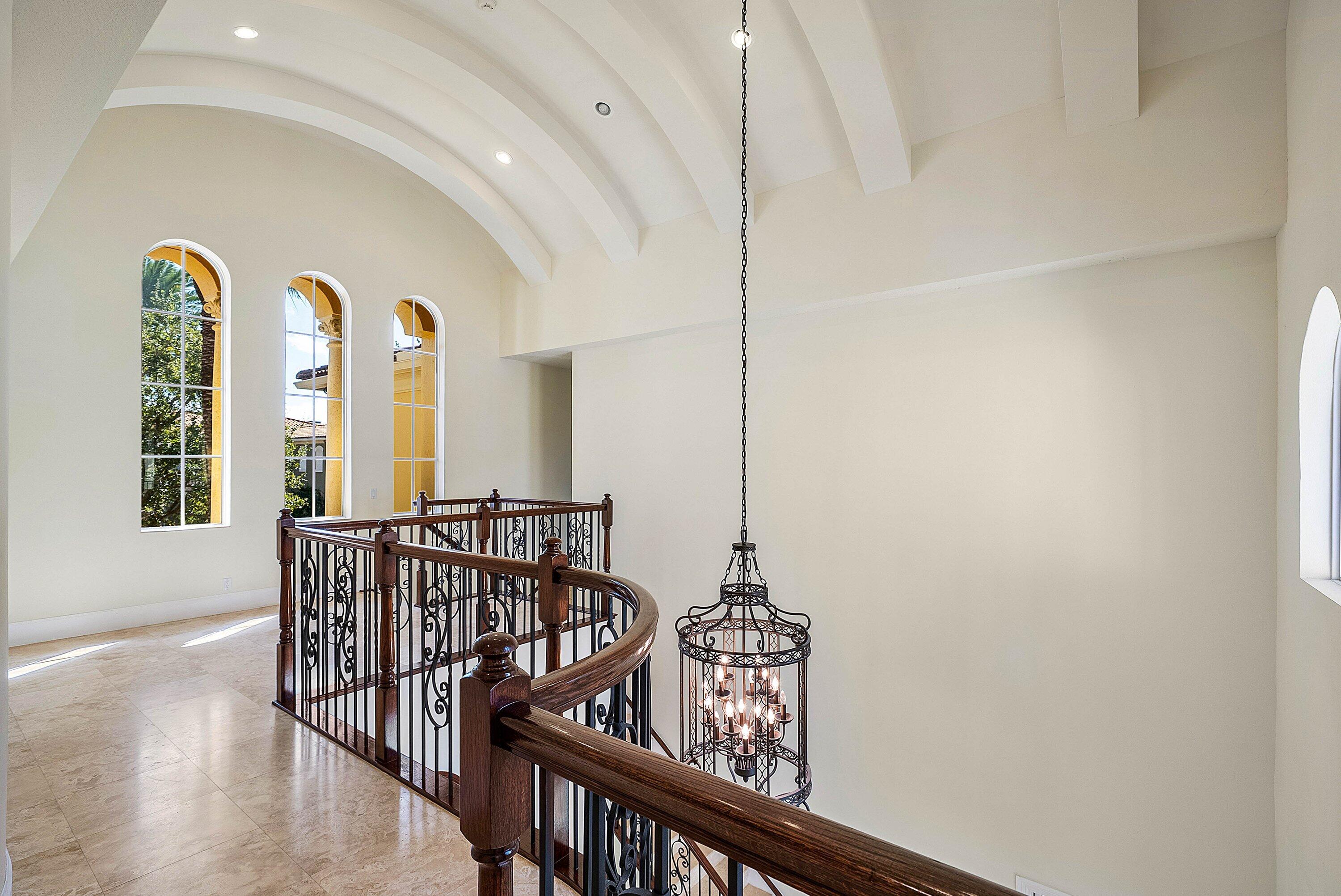17387 Balaria Street Boca Raton, FL 33496 - Photo 36 of 65 a view of a hallway with windows