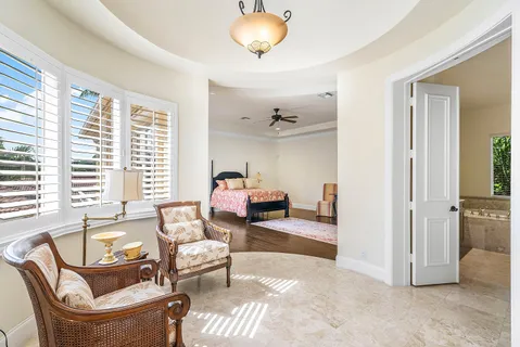 a spacious bathroom with a tub sink shower and mirror