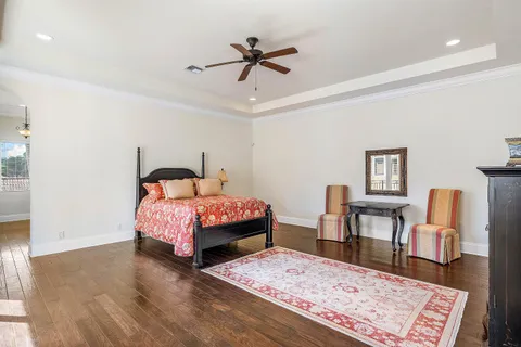 a bathroom with a tub shower sink and mirror
