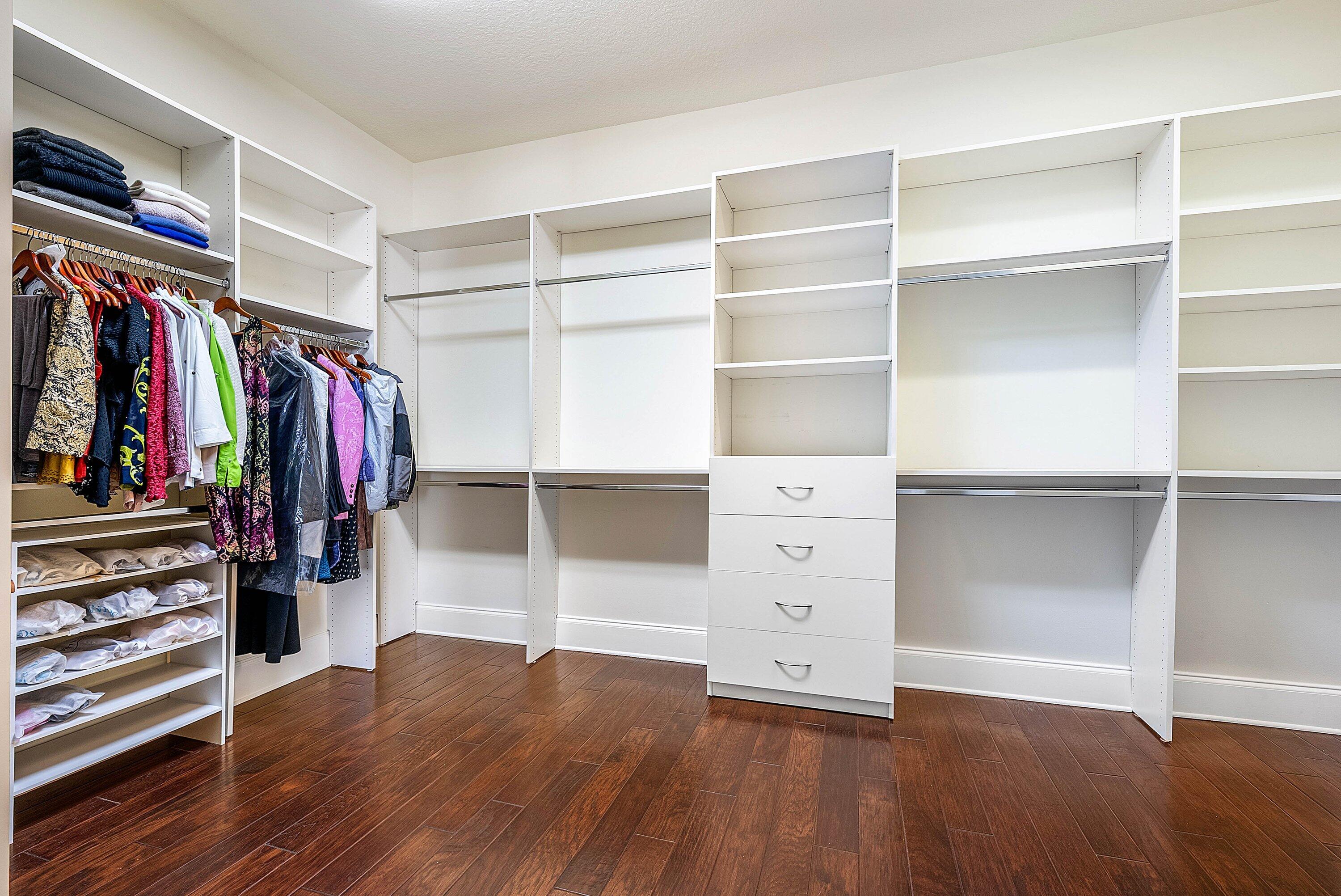 17387 Balaria Street Boca Raton, FL 33496 - Photo 44 of 65 a view of walk in closet with clothes and shoes