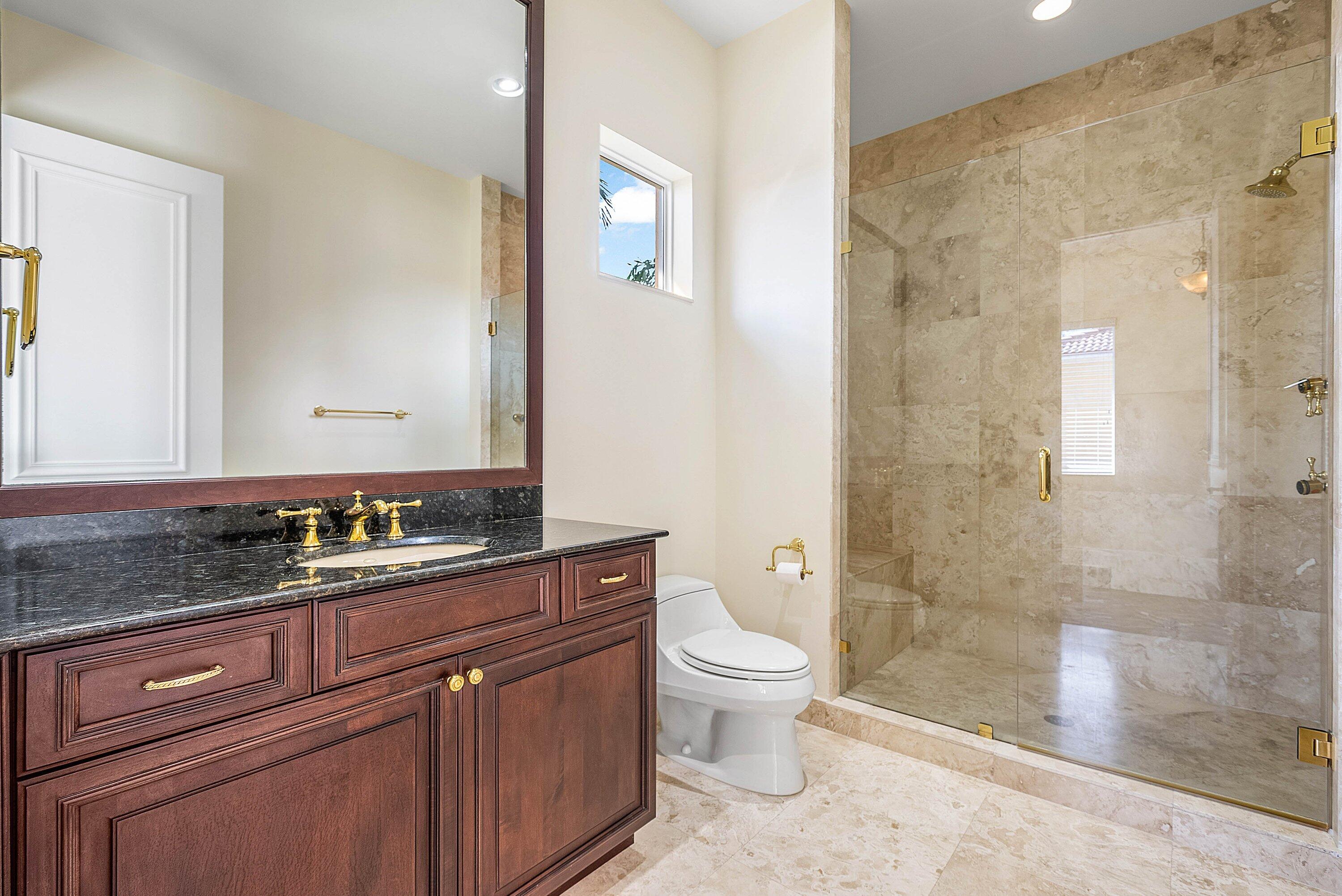 17387 Balaria Street Boca Raton, FL 33496 - Photo 46 of 65 a bathroom with a sink a toilet and shower