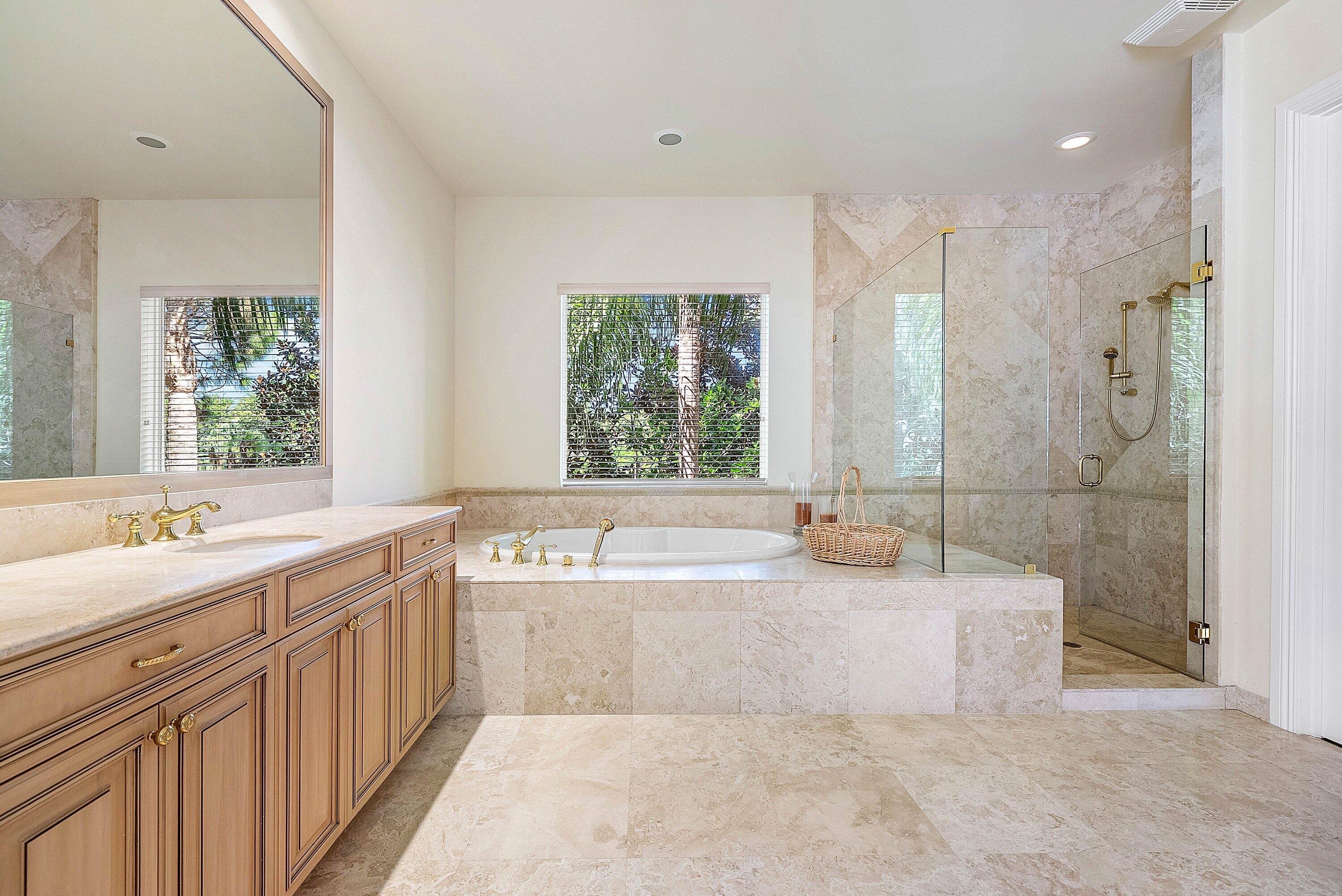 17387 Balaria Street Boca Raton, FL 33496 - Photo 47 of 65 a spacious bathroom with a tub sink shower and mirror