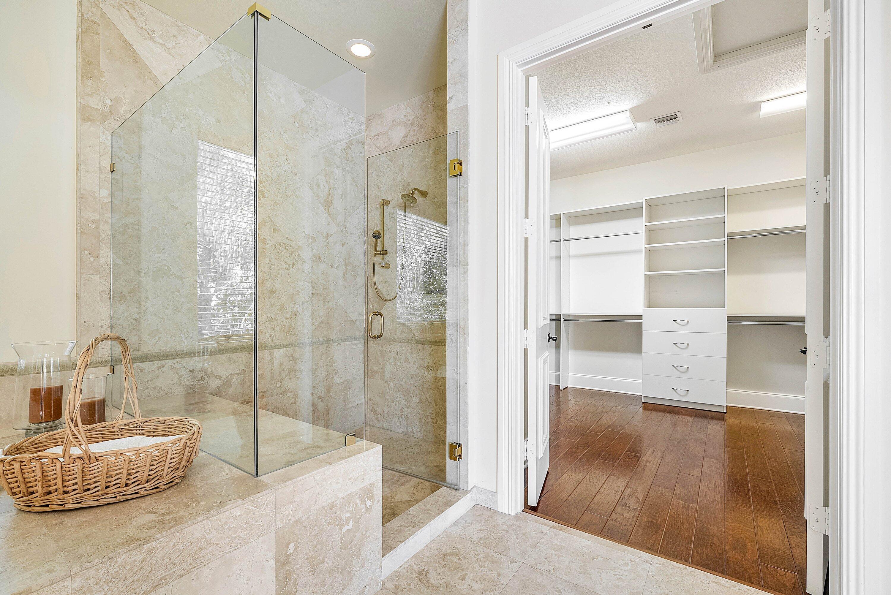 17387 Balaria Street Boca Raton, FL 33496 - Photo 48 of 65 a bathroom with a tub shower sink and mirror