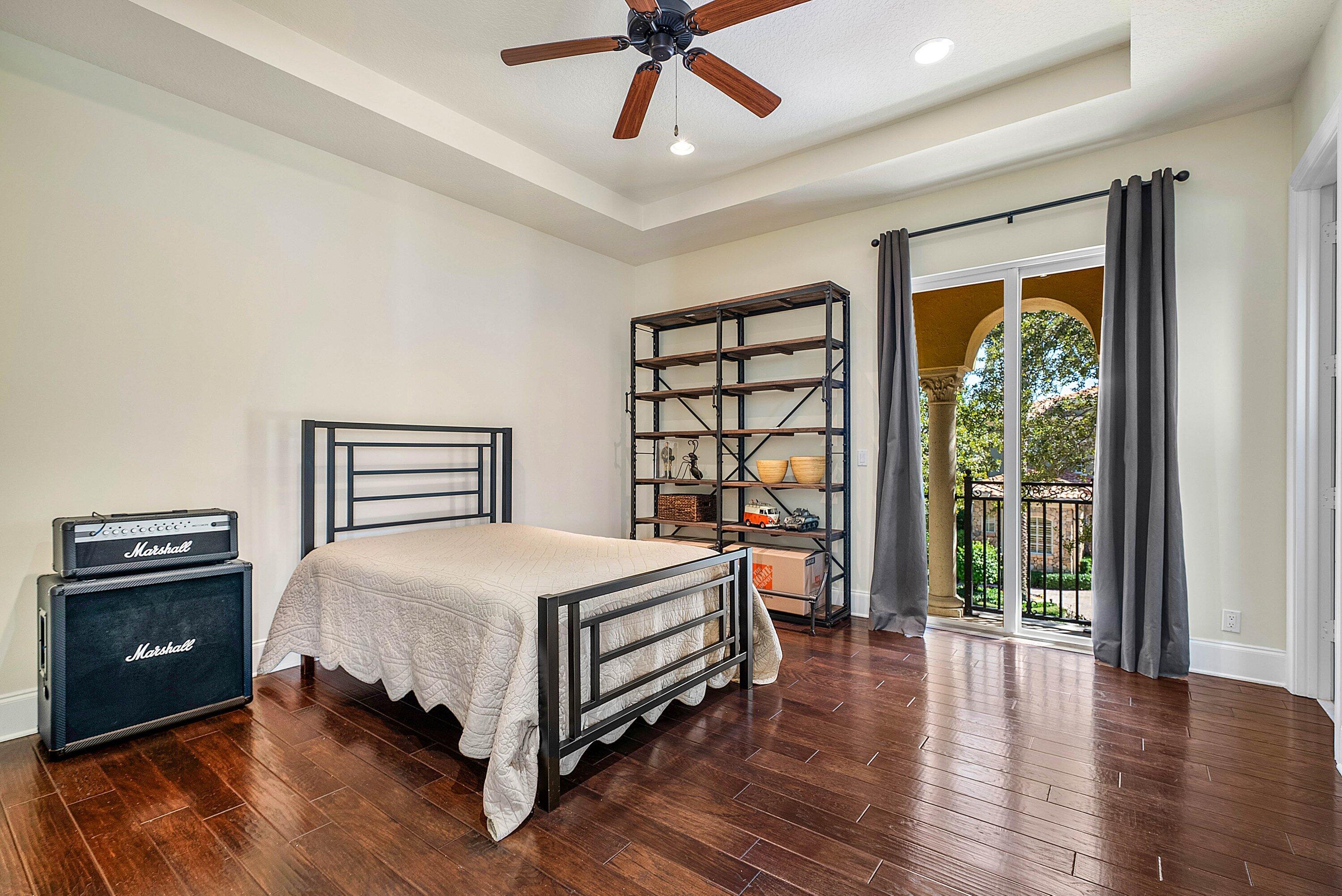 17387 Balaria Street Boca Raton, FL 33496 - Photo 53 of 65 a bedroom with a bed and a large window