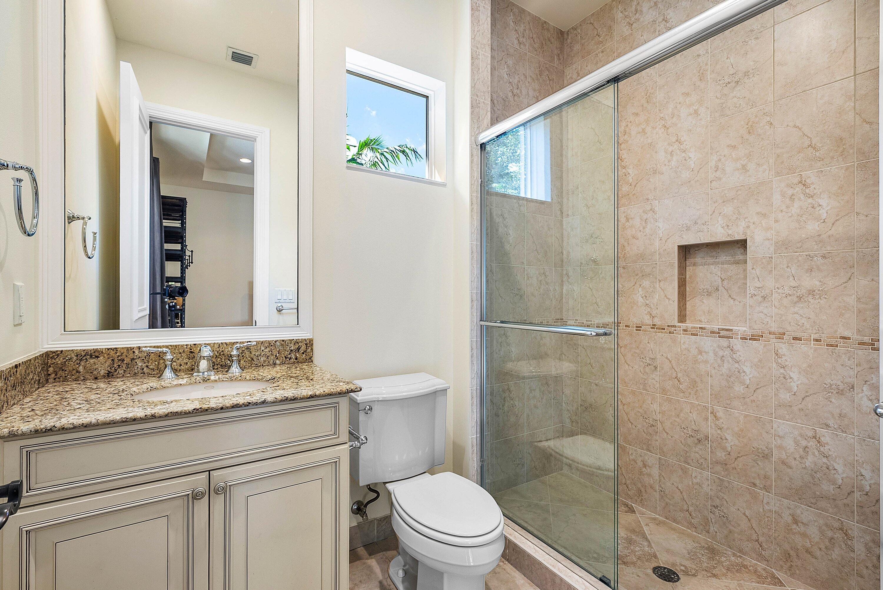17387 Balaria Street Boca Raton, FL 33496 - Photo 56 of 65 a bathroom with a granite countertop sink toilet and shower