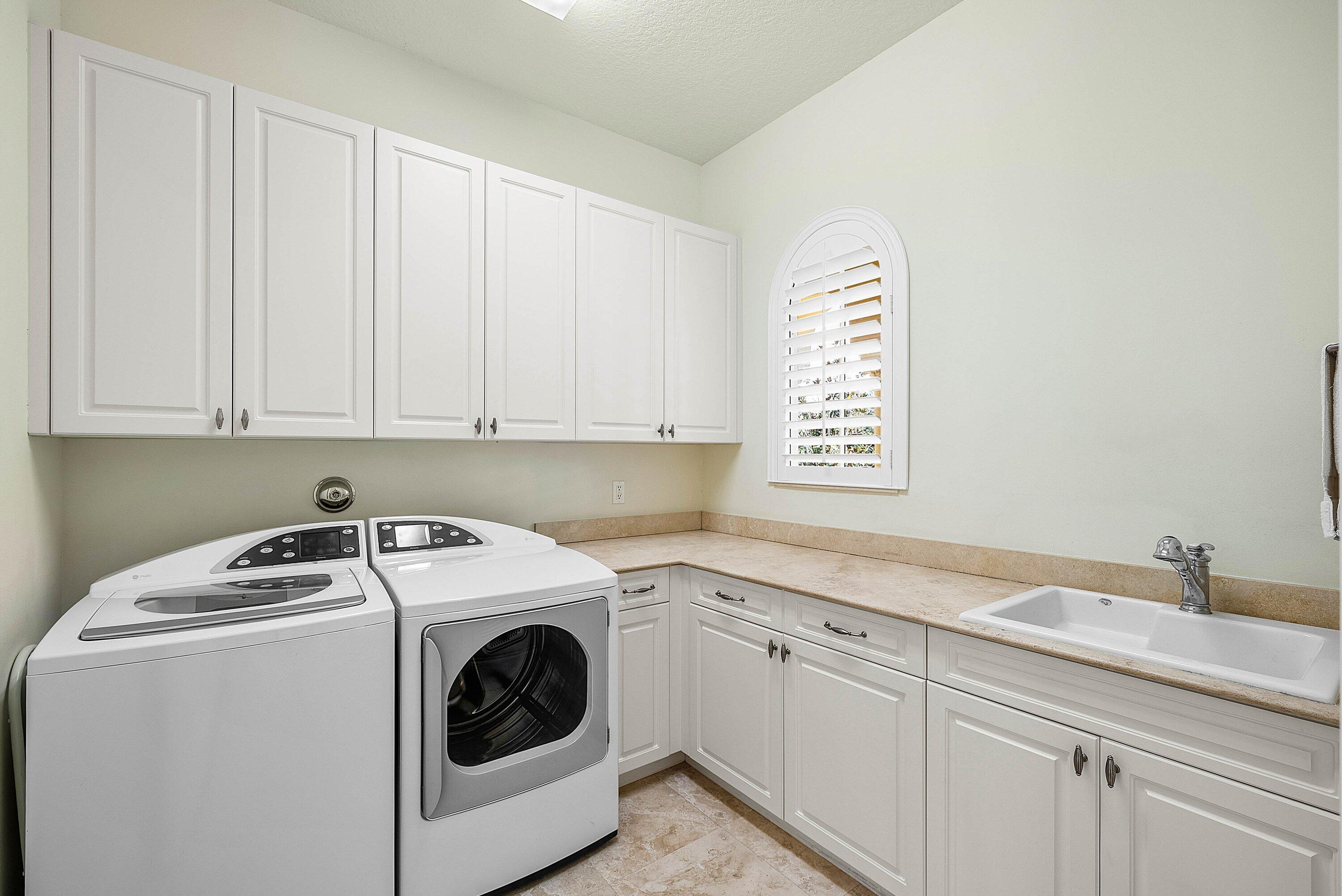 17387 Balaria Street Boca Raton, FL 33496 - Photo 58 of 65 a utility room with dryer and washer