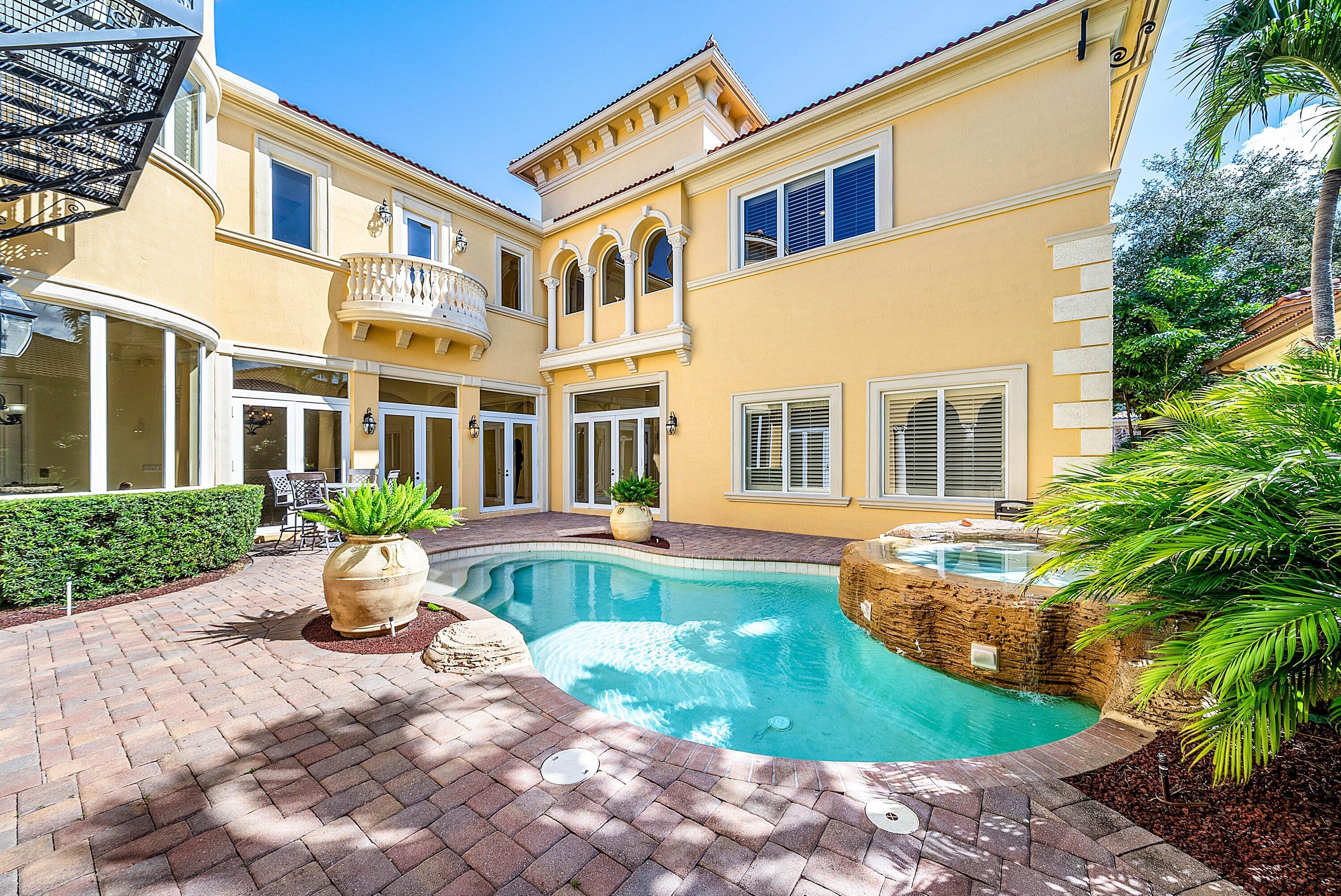 17387 Balaria Street Boca Raton, FL 33496 - Photo 61 of 65 a front view of a house with a yard chairs