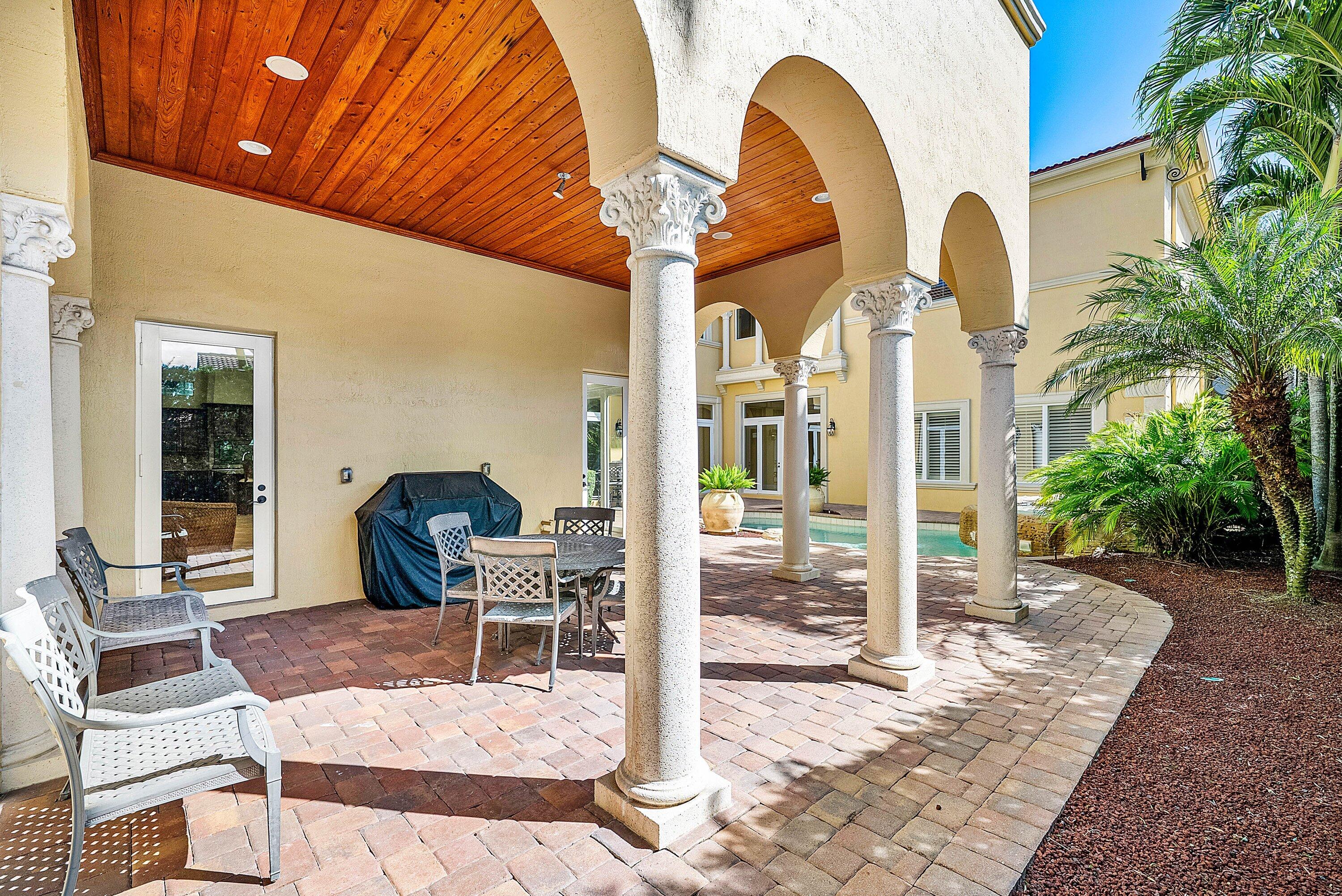 17387 Balaria Street Boca Raton, FL 33496 - Photo 64 of 65 a outdoor space with lots of white furniture