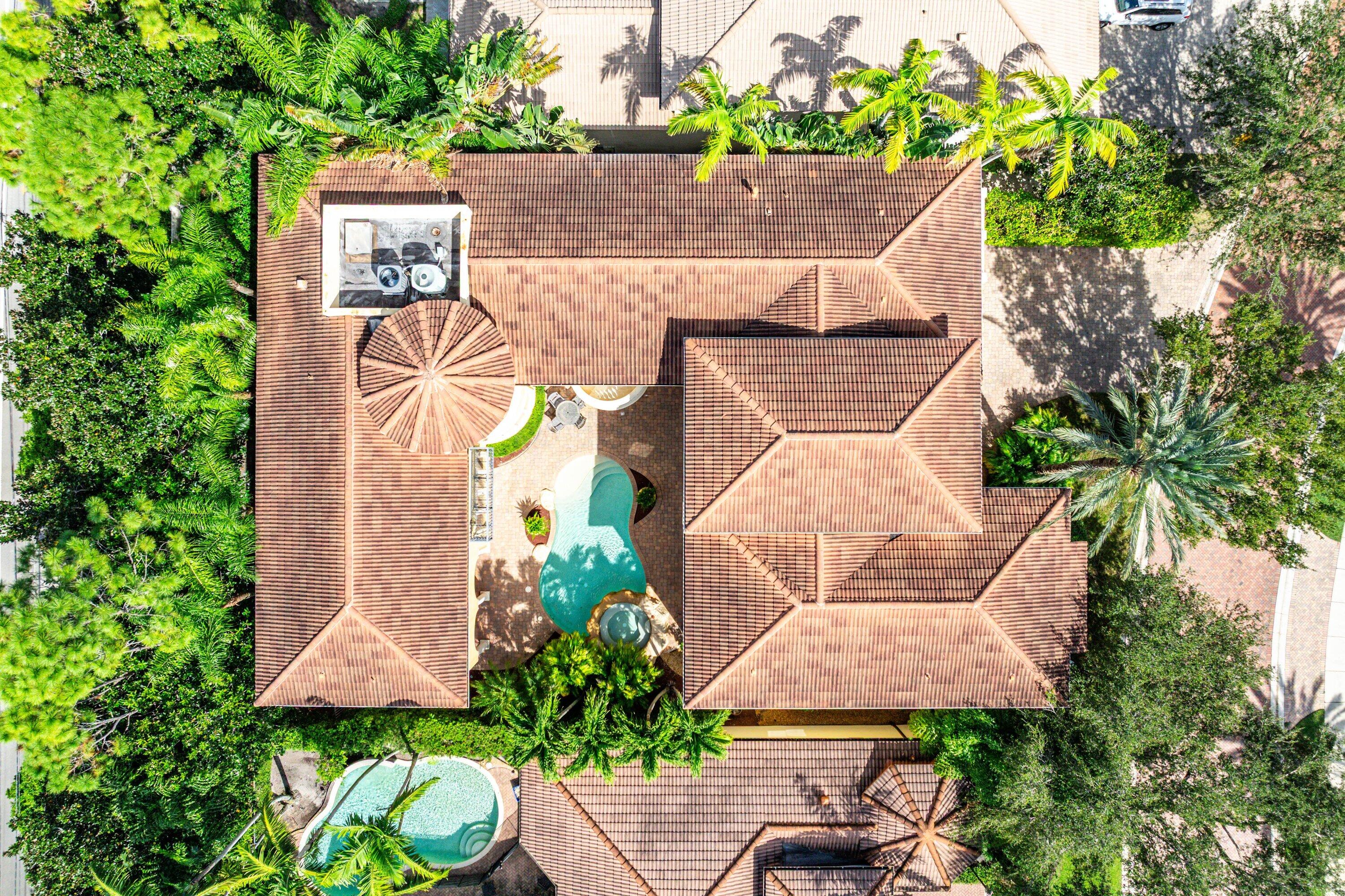 17387 Balaria Street Boca Raton, FL 33496 - Photo 10 of 65 an aerial view of a house with a yard and garden