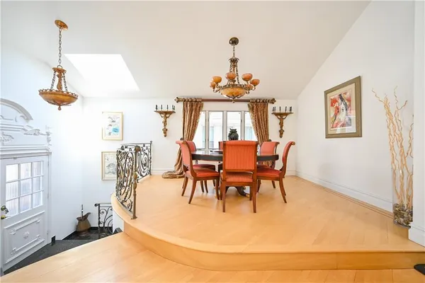 a view of a dining room with furniture and a window