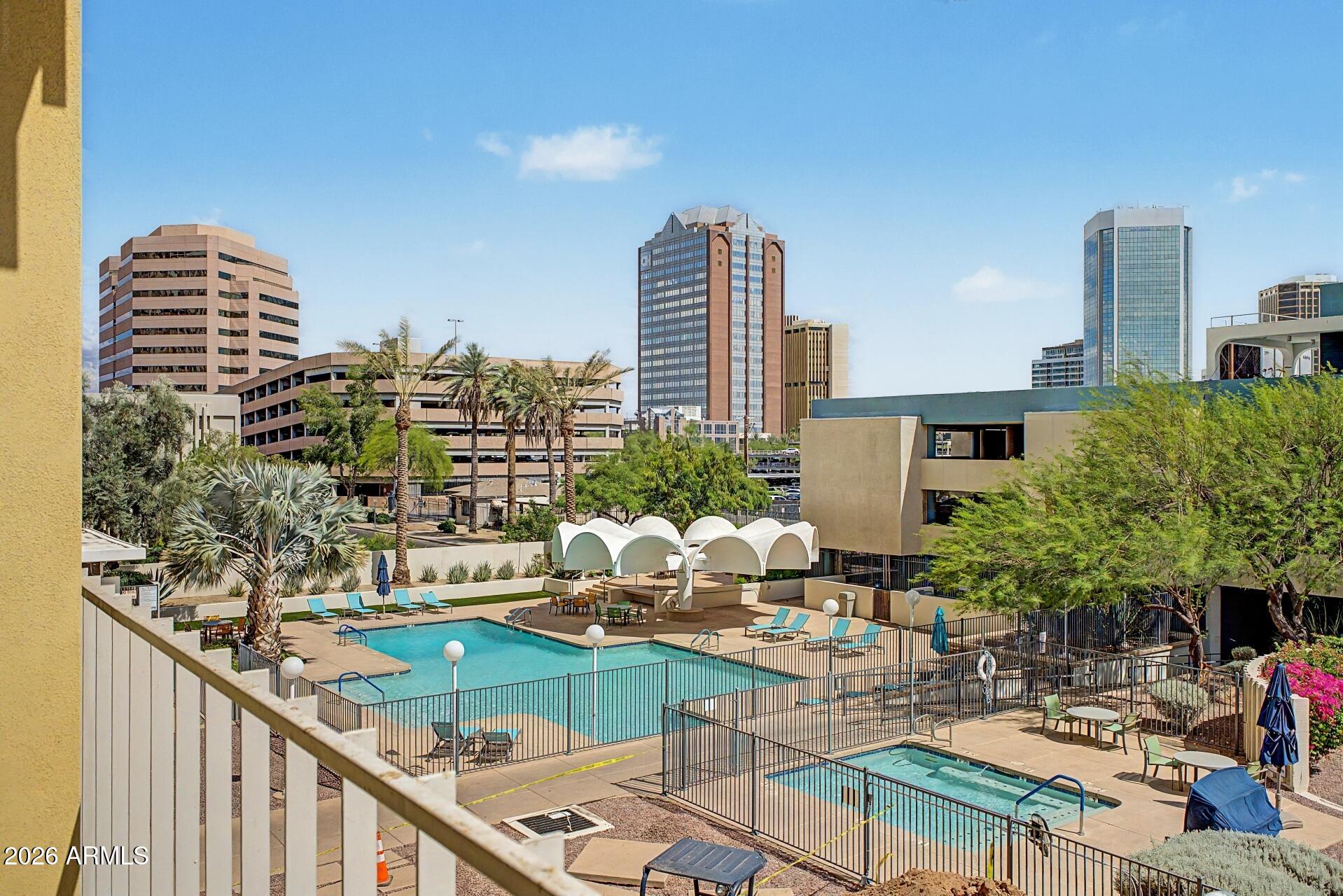 207 West Clarendon Avenue, Unit B2 Phoenix, AZ 85013 - Photo 17 of 30 a view of balcony with outdoor seating and city view