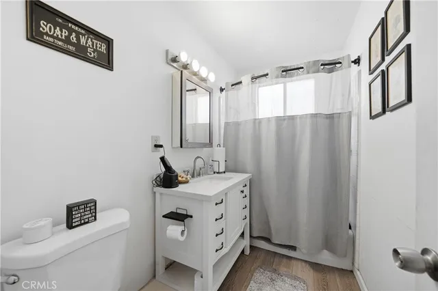 a bathroom with a sink a mirror and a shower