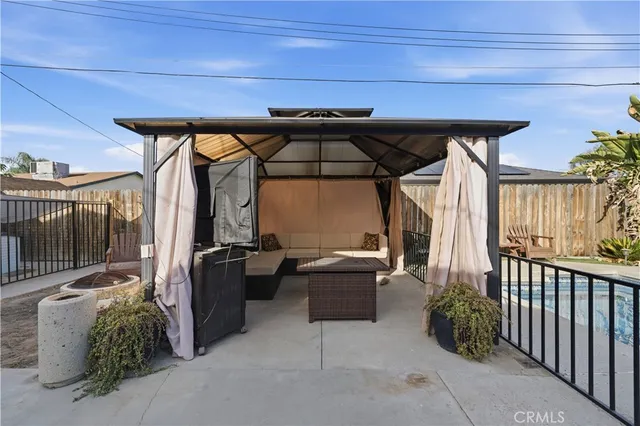 a view of a chairs and table in the balcony