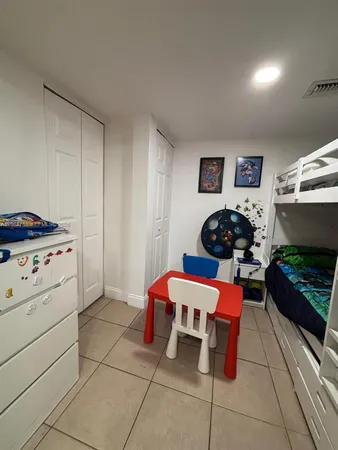 a room with furniture a flat screen tv and a fireplace