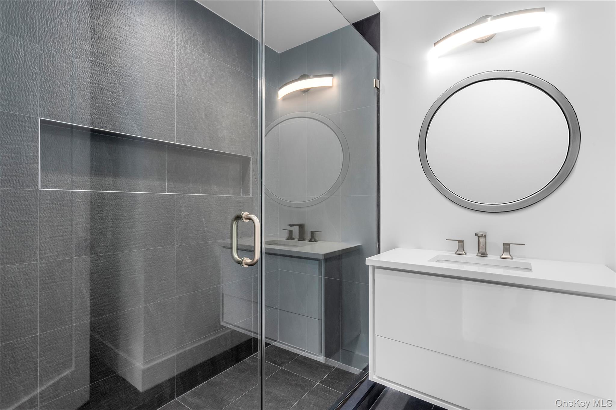 600 Glenn Road Southold, NY 11971 - Photo 12 of 22 a bathroom with a sink mirror and vanity