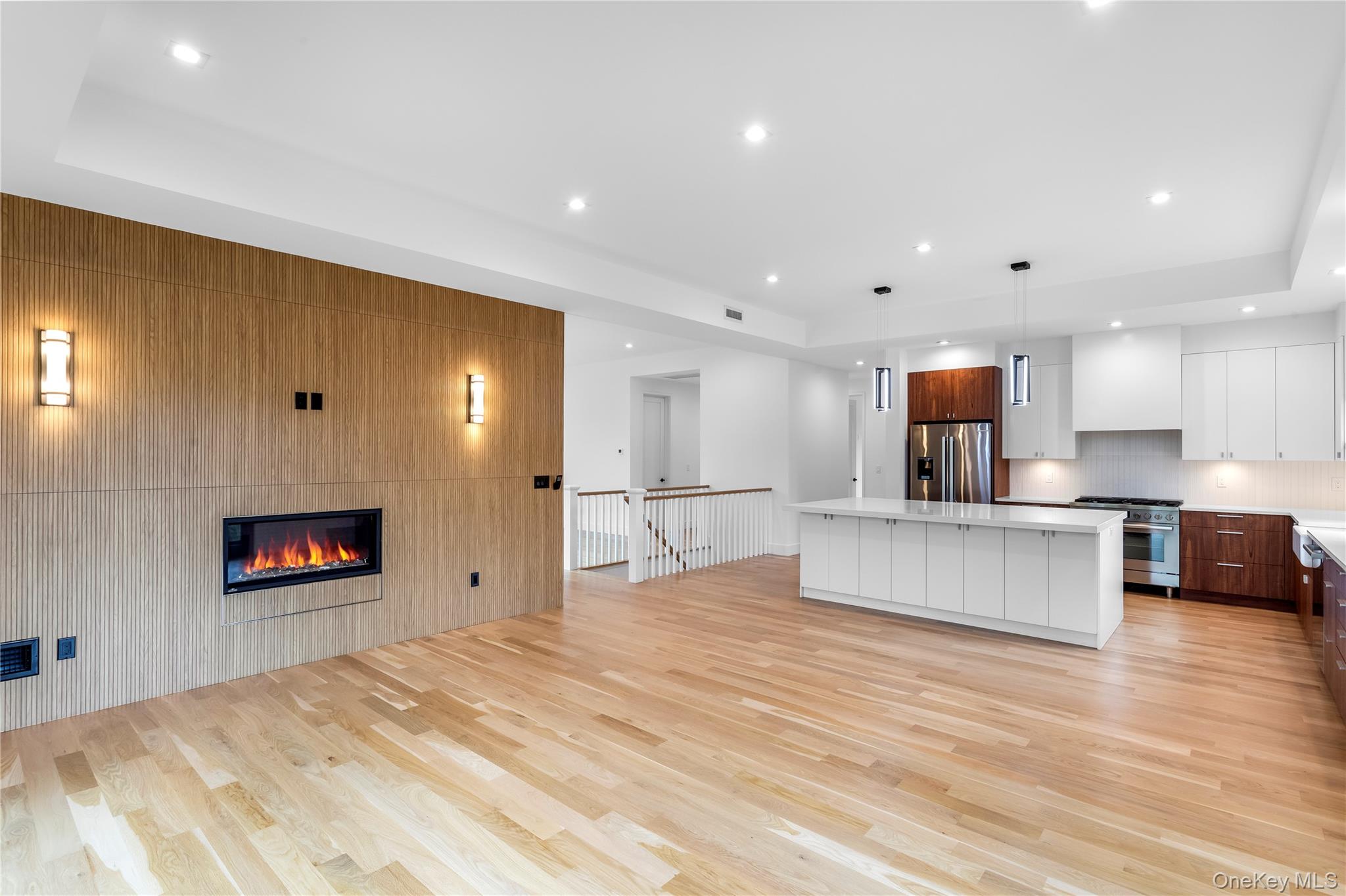 600 Glenn Road Southold, NY 11971 - Photo 17 of 22 a large kitchen with stainless steel appliances a large counter top a stove and a refrigerator