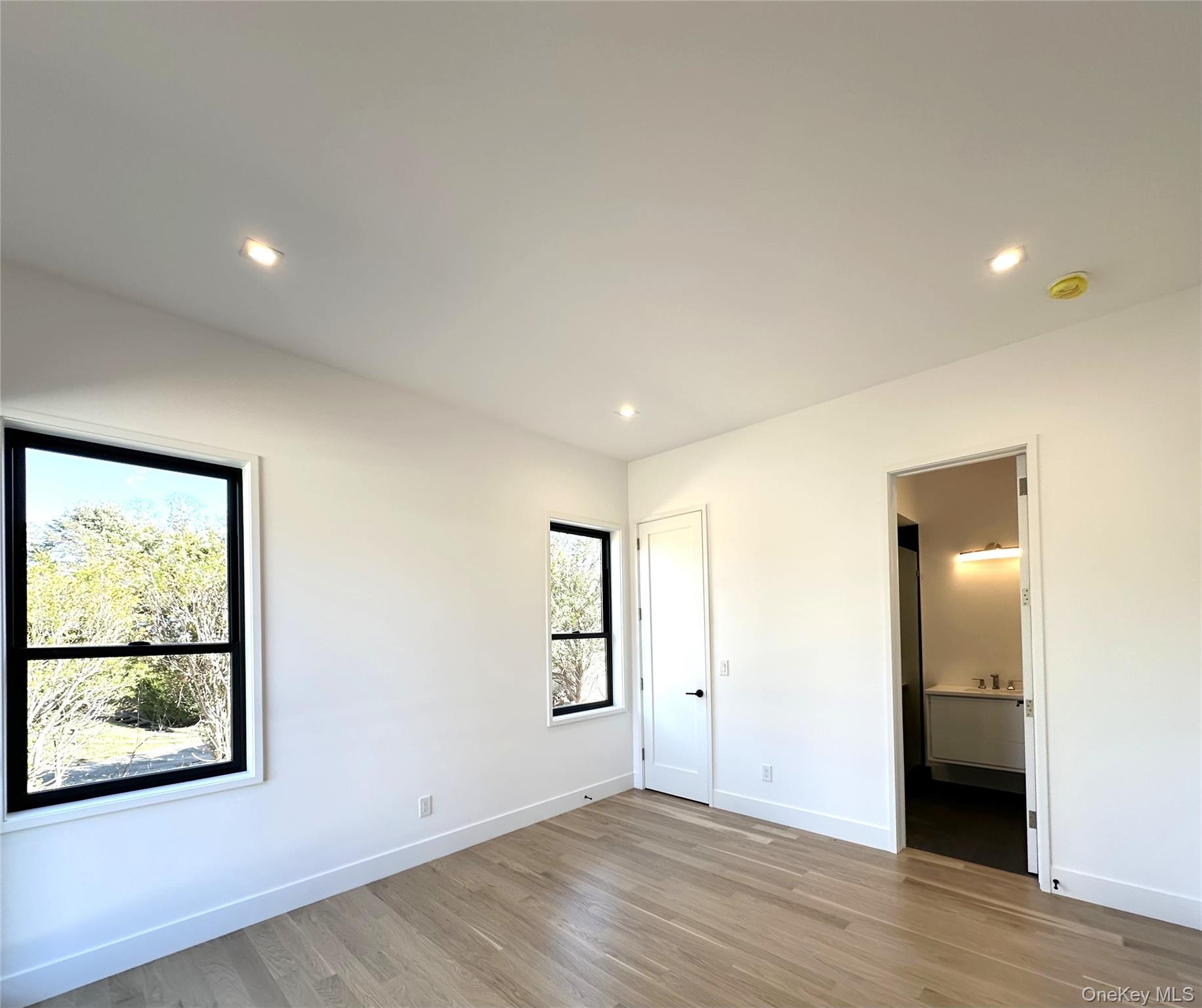 600 Glenn Road Southold, NY 11971 - Photo 10 of 22 an empty room with windows and closet