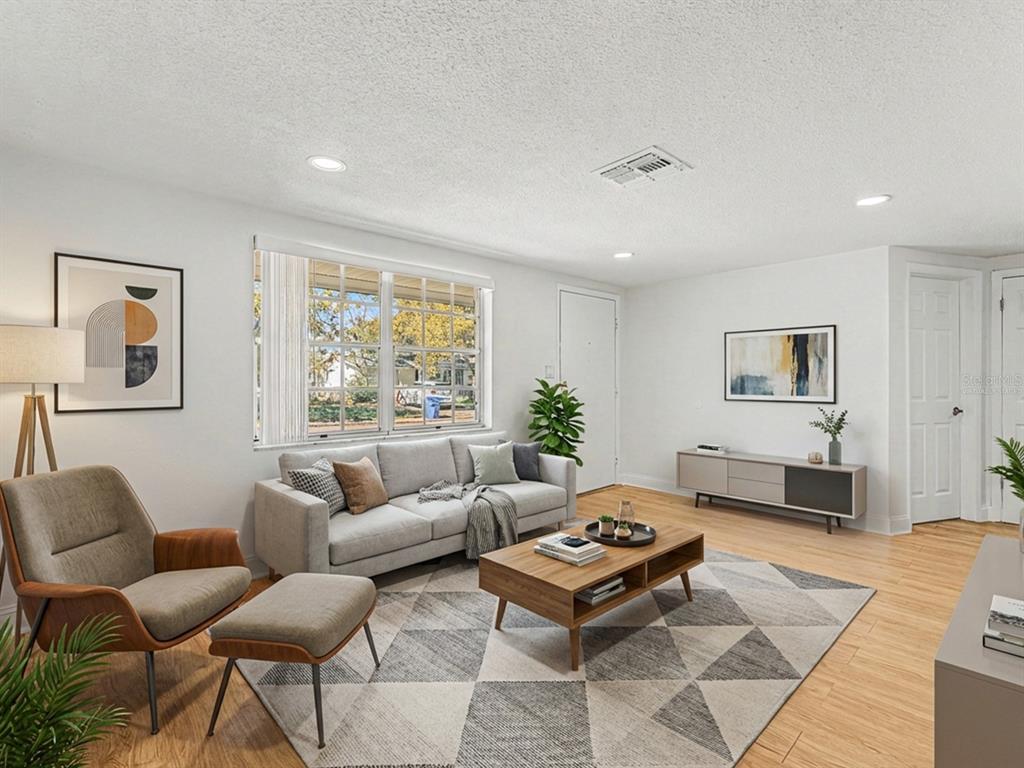 9430 Gray Fox Lane Port Richey, FL 34668 - Photo 14 of 33 a living room with furniture and a rug