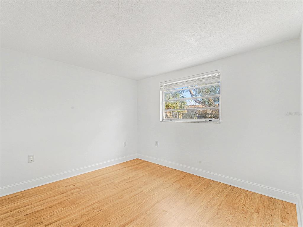 9430 Gray Fox Lane Port Richey, FL 34668 - Photo 19 of 33 an empty room with a window
