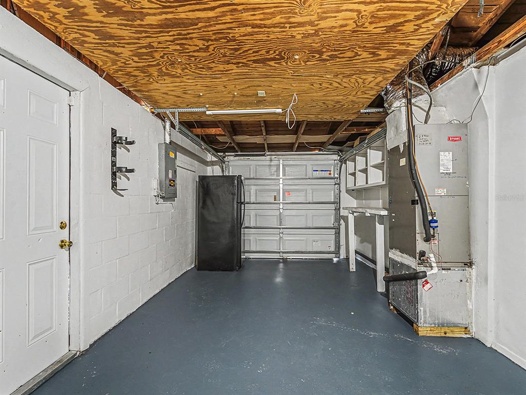 9430 Gray Fox Lane Port Richey, FL 34668 - Photo 23 of 33 a view of storage and utility room