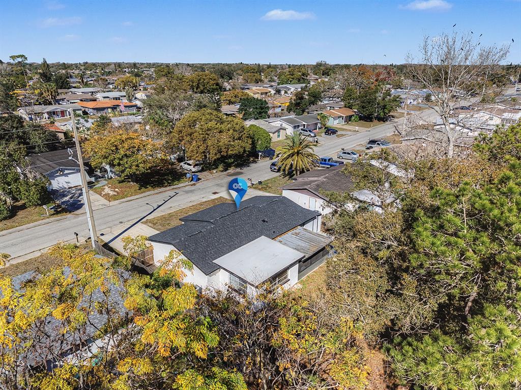 9430 Gray Fox Lane Port Richey, FL 34668 - Photo 26 of 33 an aerial view of residential houses with outdoor space