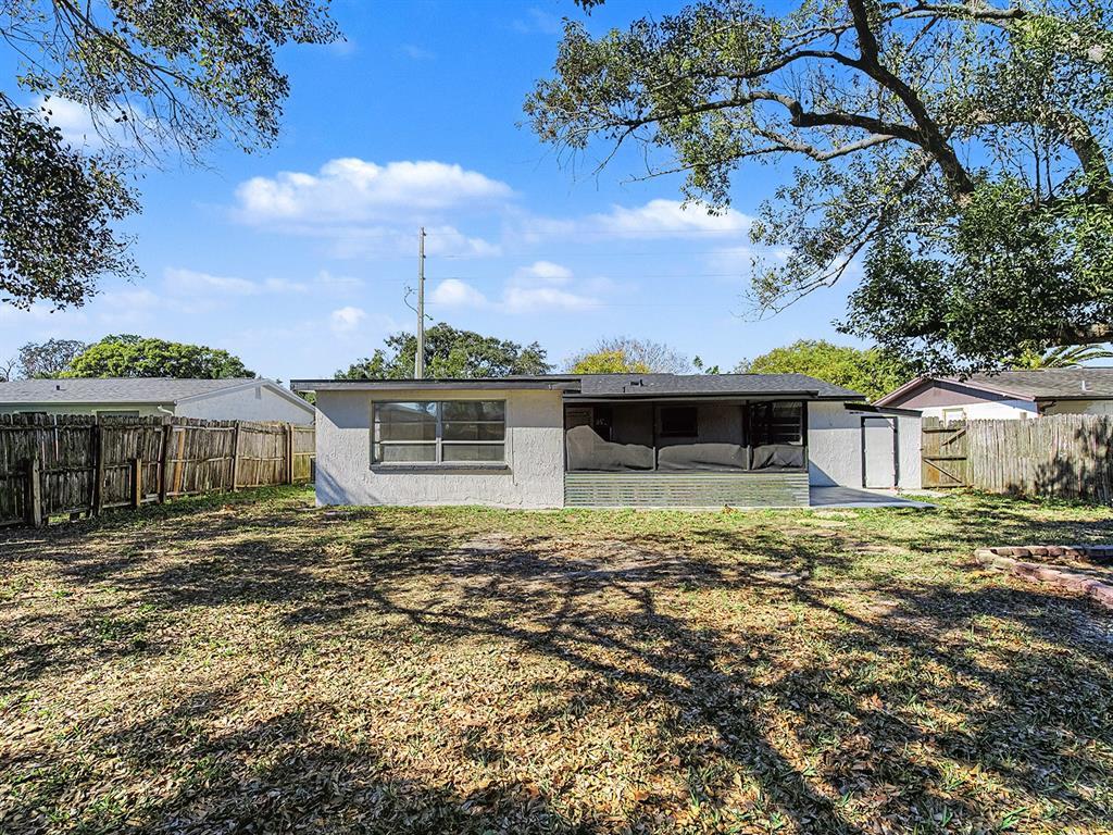 9430 Gray Fox Lane Port Richey, FL 34668 - Photo 5 of 33 a front view of a house with a yard