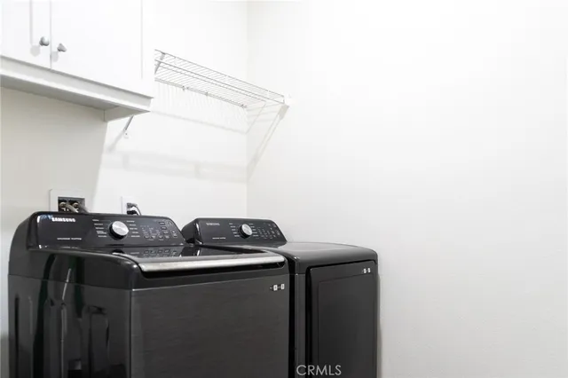 a large kitchen with kitchen island a sink counter space and stainless steel appliances